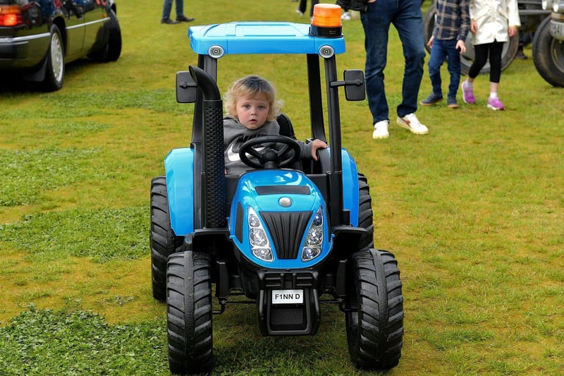 Finn Doherty, from Muff, arrives on his tractor at the Muff Vintage Show held in the Community Park on Sunday. Photo: George Sweeney.  DER2321GS – 17 