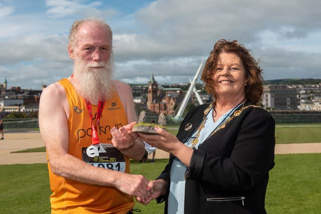 Parkrun legend George Row receives Danny Sheerin Memorial Award from the Mayor Councillor Patricia Logue. The award was established last year following the passing of the popular runner to recognise members of the local running fraternity who embody the spirit of participation and encouragement that Danny was so well known for. Mr Sheerin took part in every Waterside Half Marathon since the event’s inception in 1981, even when he was unwell with a cancer diagnosis in recent years. He took part in scores of Marathons, Half Marathons and Triathlons in the city for decades, including every Derry Marathon, and sadly passed away following his long battle with illness less than two weeks before this year’s Waterside Half.