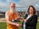 Parkrun legend George Row receives Danny Sheerin Memorial Award from the Mayor Councillor Patricia Logue. The award was established last year following the passing of the popular runner to recognise members of the local running fraternity who embody the spirit of participation and encouragement that Danny was so well known for. Mr Sheerin took part in every Waterside Half Marathon since the event’s inception in 1981, even when he was unwell with a cancer diagnosis in recent years. He took part in scores of Marathons, Half Marathons and Triathlons in the city for decades, including every Derry Marathon, and sadly passed away following his long battle with illness less than two weeks before this year’s Waterside Half.