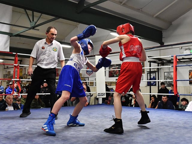 Shane Green, The Ring and Finnian Devlin, St Johns go toe-to-toe as referee Eugene 'Budge' O'Kane looks on. Photograph: George Sweeney