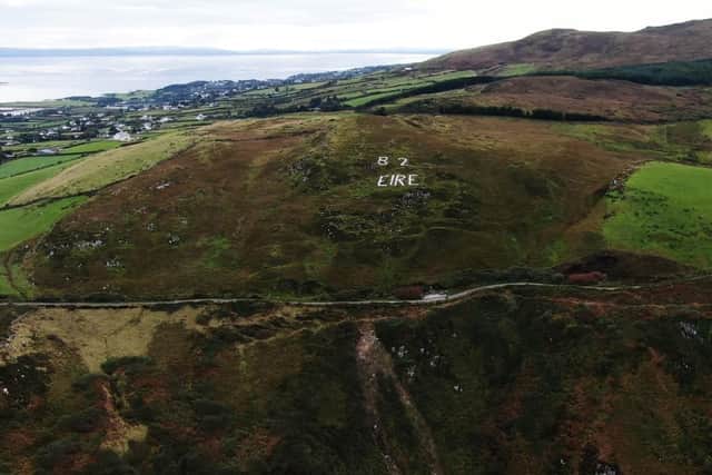 Another view of the EIRE 82 sign at Inishowen Head, which has been restored.