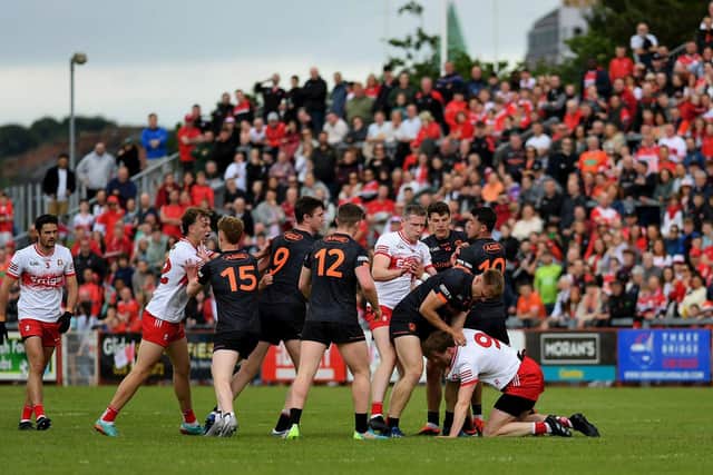 Tensions rise between Derry and Armagh players. Photo: George Sweeney