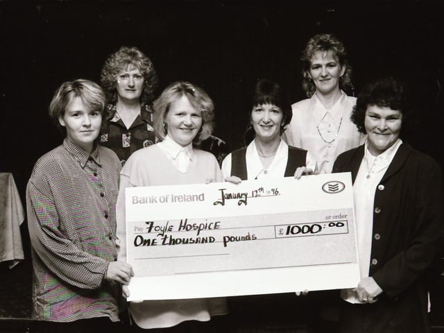 Mary McDaid presenting a cheque for £1,000 to the Foyle Hospice.