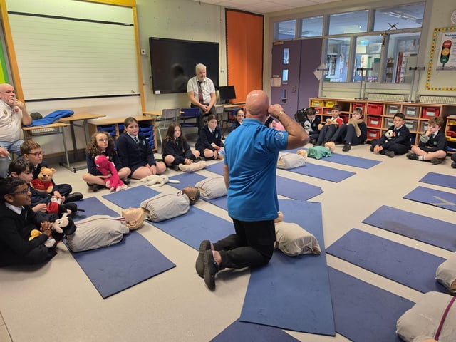 Heart of Foyle delivering a free session on basic life support at St Patrick's Primary School as part of October's International restart a heart.