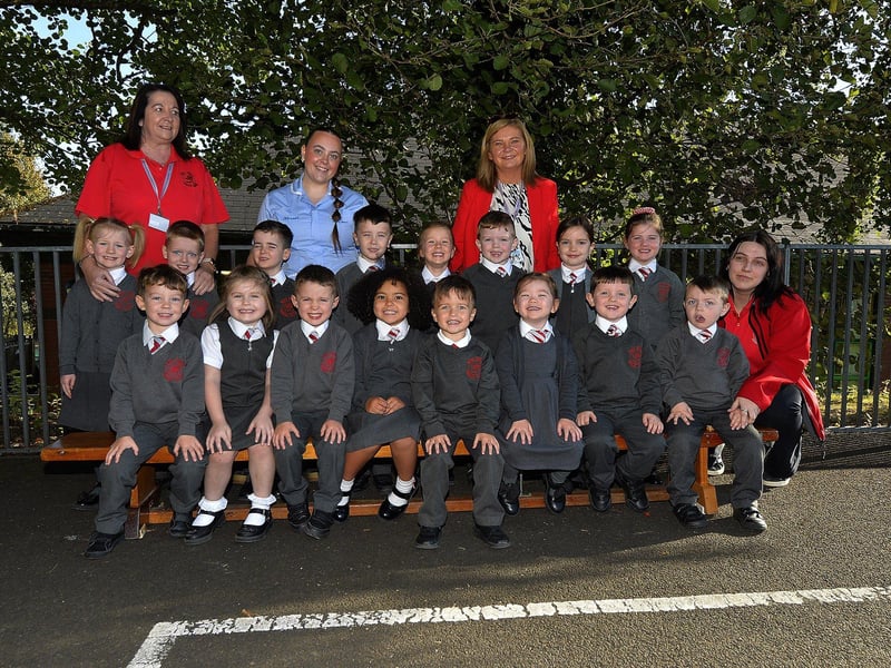 Teacher Mrs Parke (second from right) with P1 pupils and classroom assistants at Holy Family Primary School.