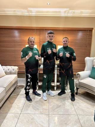 Fifteen year old Derry kickboxer Kyle Moore pictured with his coaches, Gary Kelly and Eamon Lynn of ellys Freestyle Martial Arts in Dungiven.