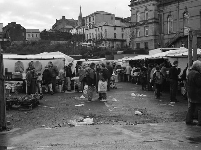 Shoppers and traders at the market on Foyle Street