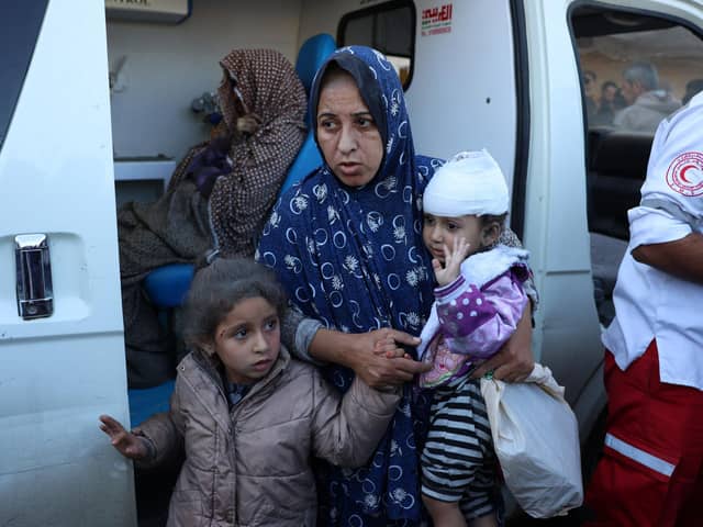 Palestinian women and children injured in an Israeli strike, wait in an ambulance in front of the al-Aqsa Martyrs Hospital in Deir Al-Balah in the central Gaza Strip on November 17, 2024, amid the ongoing war between Israel and the Palestinian Hamas militant group. (Photo by BASHAR TALEB / AFP) (Photo by BASHAR TALEB/AFP via Getty Images)