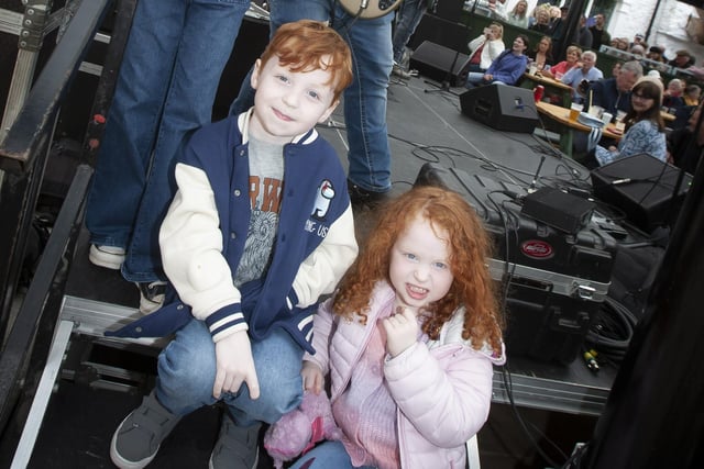 Oisín and Neala Butler enjoying the fun at the Jazz Festival with the Garage Boys in the Craft Village