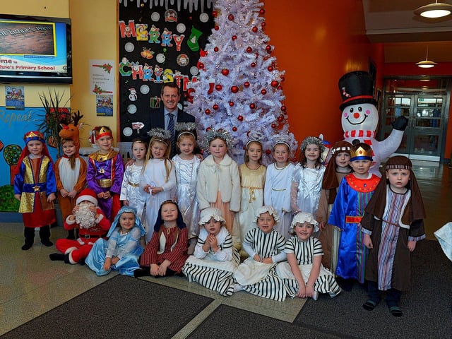 Pupils from Mrs Logue's P1 class at St Eithne's Primary School, who performed their Nativity Play on Wednesday for family and relatives, pictured with Mr Terence McDowell school principal. Photo: George Sweeney. DER2249GS - 06