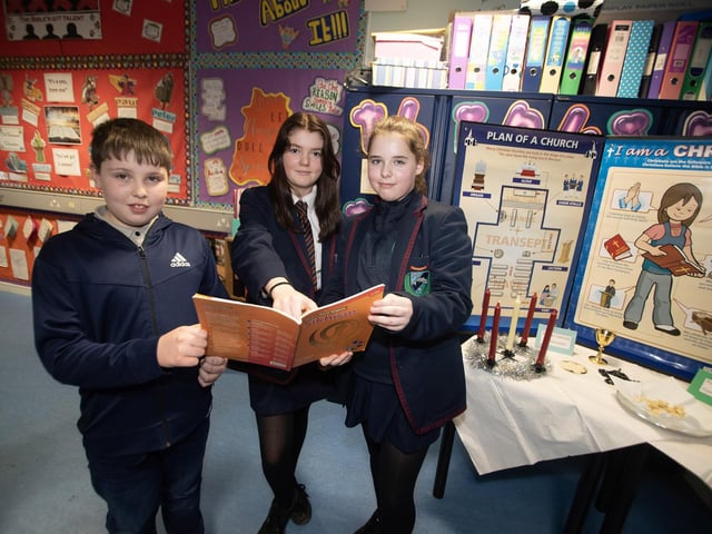 Samuel McKinney, Oakgrove Primary School pictured on a visit to the RE Department at Oakgrove with Year 8 students Miley Deery and Aimee Millar.