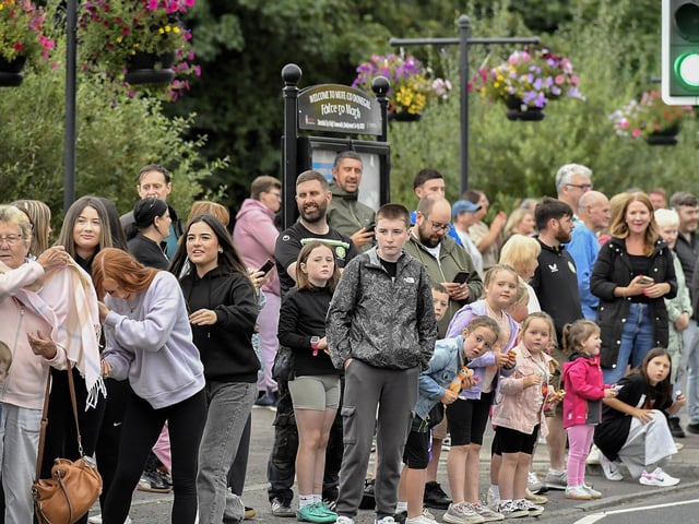 Spectators at the Muff Feile opening parade makes on Friday evening. Photo: George Sweeney