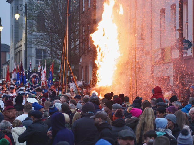 An effigy of Colonel Robert Lundy burning in Bishop Street on Saturday.