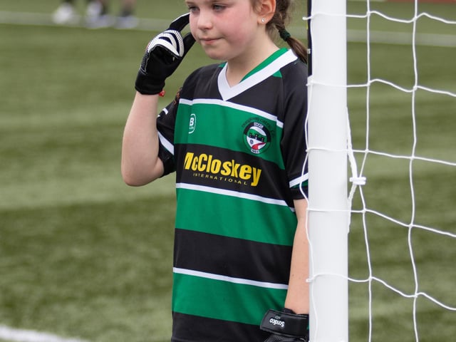 This young keeper issues instructions to her defence as they prepare for a corner.
