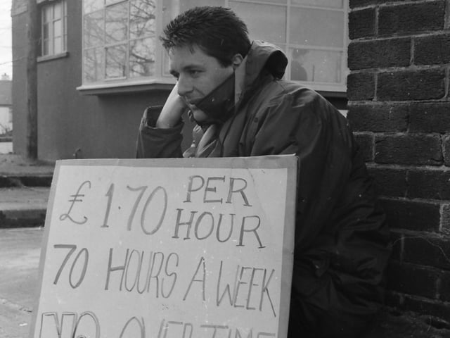 A worker taking part in a picket at Arntz Belting on Pennyburn Pass.