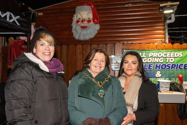 The Mayor Councillor Patricia Logue was on hand at Amelia Court in Steelstown to switch on the Christmas Lights and meet Mr and Mrs Claus whose Grotto officially opened for the festive period until Christmas Eve. This year donations are in aid of the Foyle Hospice and Macmillan Cancer Support. Shelia Duffy, left,  Director of Income Generation and Communications at the Foyle Hospice also took part with Michaela Harkin. Picture Martin McKeown. 01.12.23