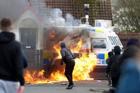 Youths throw petrol bombs at a PSNI vehicle ahead of a republican Easter parade in Creggan on Easter Monday. Picture date: Monday April 10, 2023.