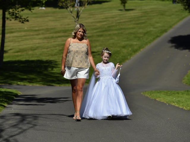 Clara and First Holy Communion girl Caoimhe enjoy a stroll in Brooke Park. Photo: George Sweeney