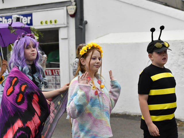 Muff Feile opening parade makes its way through the village on Friday evening. Photo: George Sweeney