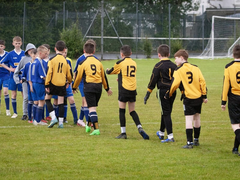 Players from St. John's and Rosemount A shake hands after a group game in the Sean O'Kane Cup on Thursday.