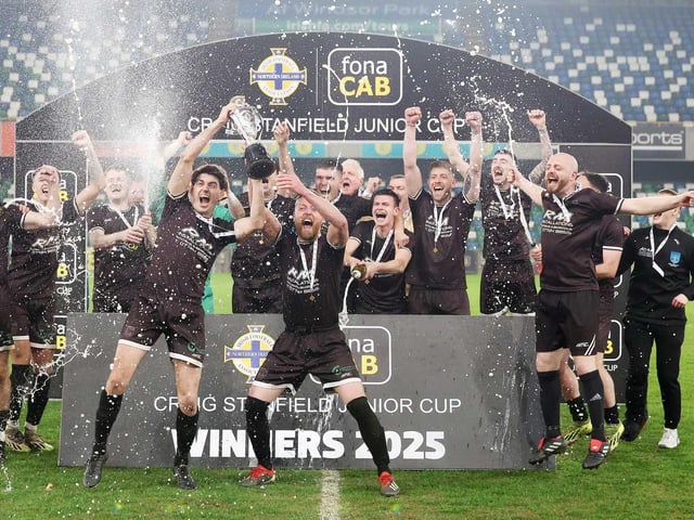 Celebration time as Jack Higgins and Brian Rainey hold aloft the Irish Junior Cup. (Photo: IFA)