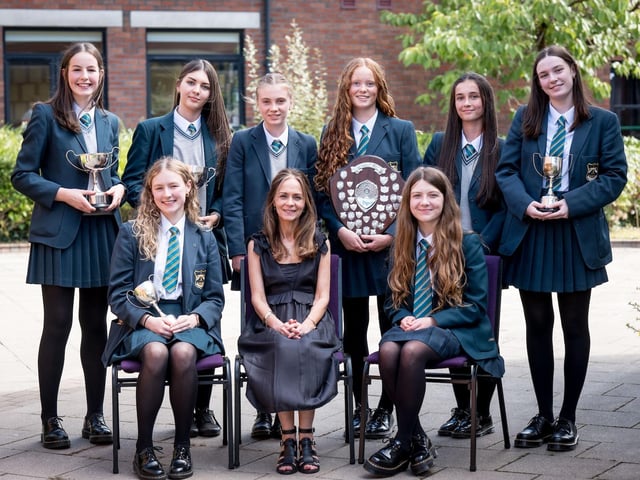 Top Performing Student in Each Subject. Front Row: Aoife Mullen, Ms A. McWilliams (Senior Teacher), Holly Hutcheon. Back Row: Katy Creagh, Ebony Griffin, Molly Heaney, Sarah Hunter, Anna McDaid, Ava Roddy.