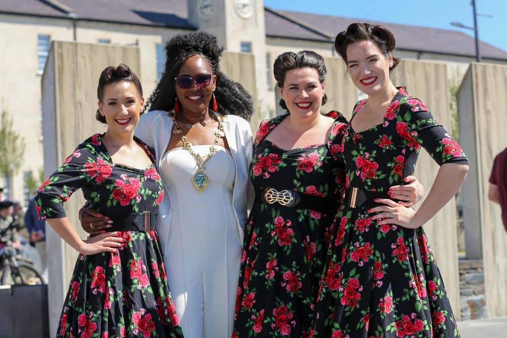 BoA Battle of the Atlantic 80th Anniversary event at Ebrington Square, Derry.   The Mayor of Derry and Strabane, Councillor Lilian Seenoi-Barr with the Swingtime Starlets.   Credit ©Lorcan Doherty