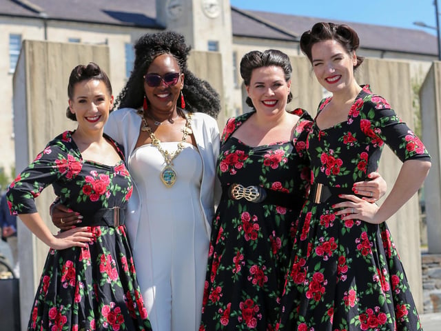 BoA Battle of the Atlantic 80th Anniversary event at Ebrington Square, Derry. The Mayor of Derry and Strabane, Councillor Lilian Seenoi-Barr with the Swingtime Starlets. Credit ©Lorcan Doherty
