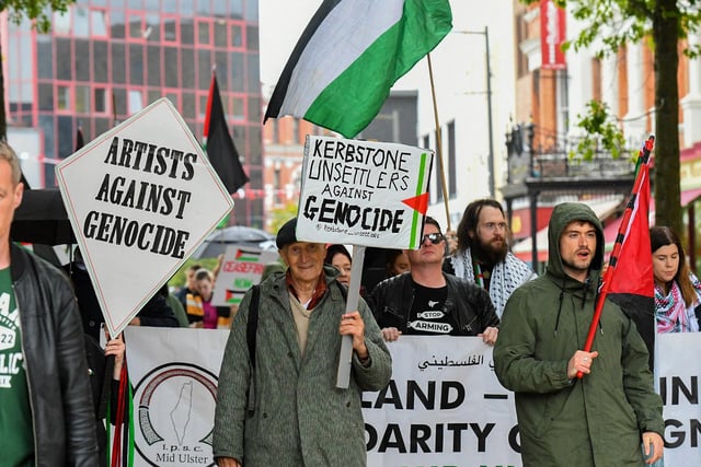 People make their way from Free Derry Wall to Guildhall Square to hear Palestinian photojournalist Motaz Azaiza. Photo: George Sweeney