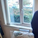 Martin Wade beside a pillow destroyed by damp. He can no longer use his bedroom.