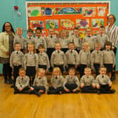 Mrs Stephanie McLaughlin, on the right, pictured with her P1 class at Sacred Heart Primary School.  Also in the photo is Bronagh, classroom assistant.