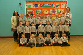 Mrs Stephanie McLaughlin, on the right, pictured with her P1 class at Sacred Heart Primary School.  Also in the photo is Bronagh, classroom assistant.