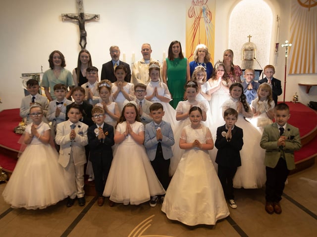 Pupils from St. Brigid's Primary School who received the Sacrament of First Holy Communion from Fr. Sean O'Donnell at St. Brigid's Church, Carnhill on Friday last. (Photo: Jim McCafferty Photography)