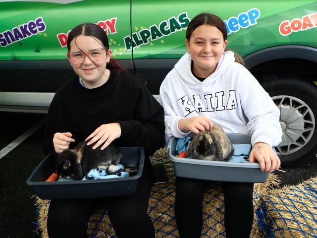 Raina Roberts and Mollie Harkin looking after the rabbits at the St Brigid’s Heart of Community Festival on Saturday. (Photo - Tom Heaney, nwpresspics)