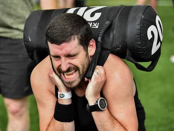 Competitor carries 'Sandbag Lunge' during the Maiden City Hyrox V Fitness Challenge held at Sean Dolans GAC on Saturday. Photograph: George Sweeney