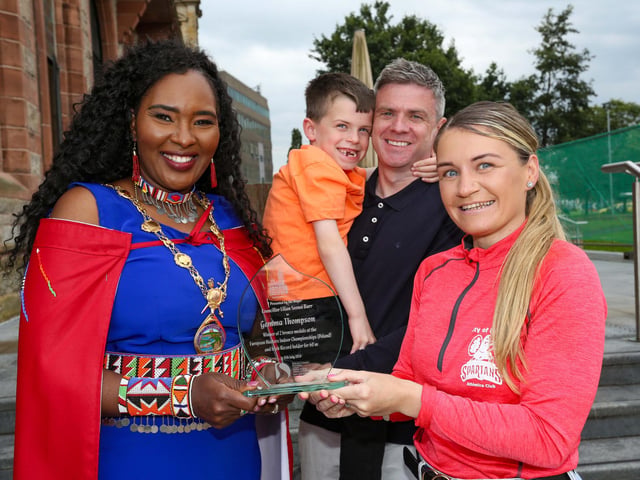 The Mayor of Derry Councillor Lilian Seenoi Barr presenting a civic gift to Gemma Thompson, City of Derry Spartans Athletic Club, at in reception in the Guildhall following her recent success in winning 2 medals at the European Masters Indoor Championships in Poland. Gemma won the medals in the 200m and 60m setting an Irish Record. Included are Gemma’s husband Eoghan Tucker & son Shane (7).Photo Lorcan Doherty
