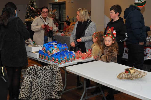 Browsing the stalls at a previous Galliagh Community Response Christmas Craft Fair held in Pio House Parish Centre held in aid of Foyle Down Syndrome Trust.  Photo: George Sweeney. DER2250GS – 84