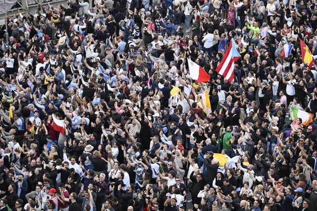 Crowds greet the election of Pope Leo XIV at St. Peter's on Thursday.