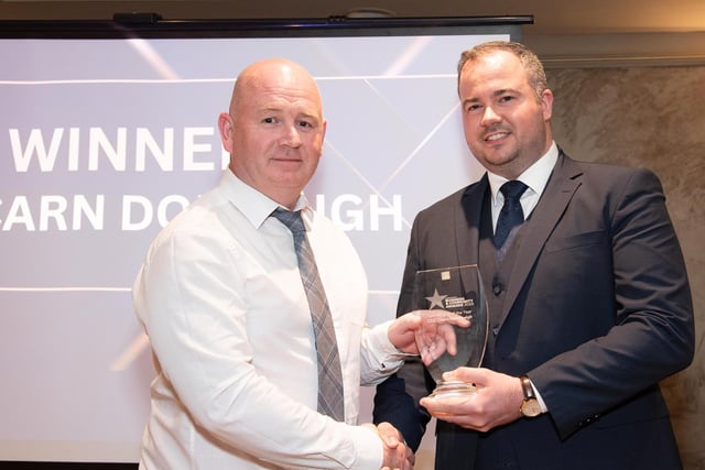 Philip McLaughlin, CLG Charn Domhnaigh collects the Sports Club of the Year Award, sponsored by Express Food Service from Davin Doherty at the Carndonagh Traders Business and Community Awards in the Ballyliffin Lodge Hotel on Saturday night last. Photo Clive Wasson.