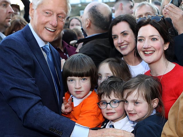 Bill Clinton greets the public outside the Guildhall.