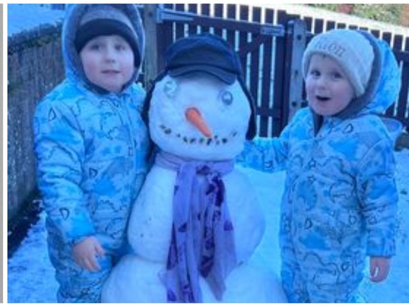 Pictured are three year old twins Cody and Ríon who have been busy building their first ever snowman. Photo: Cara Ó Dubhthaigh
