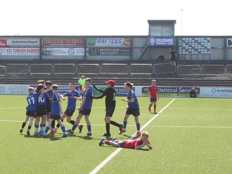 AGONY AND ECSTACY . . St Columb's College players celebrate as Lisneal players drop to the ground.