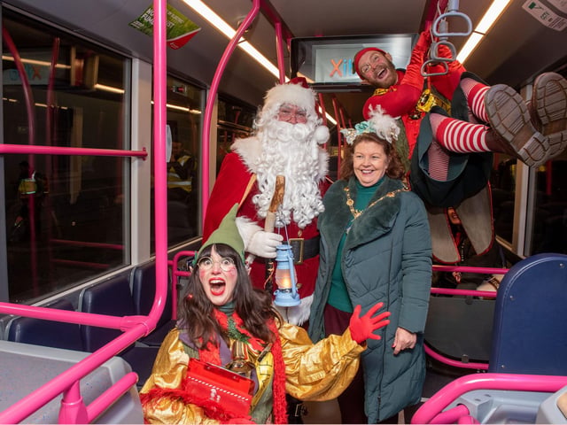 Mayor Patricia Logue with festive characters at the Procession.