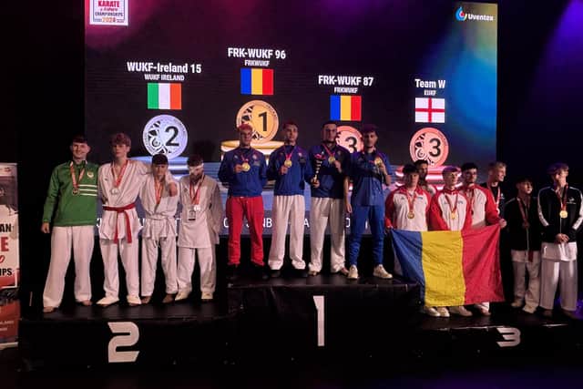 SILVER STREAK . . . Killian Doherty and Patrick Moynihan (on far left) won silver as part of the WUKF Ireland teams in both Sanbon and Team Rotation.