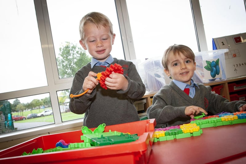 P1 pupils Luke and Milo playing happily with the cogs at St. Brigid's PS this week. (Photos: JIm McCafferty Photography)