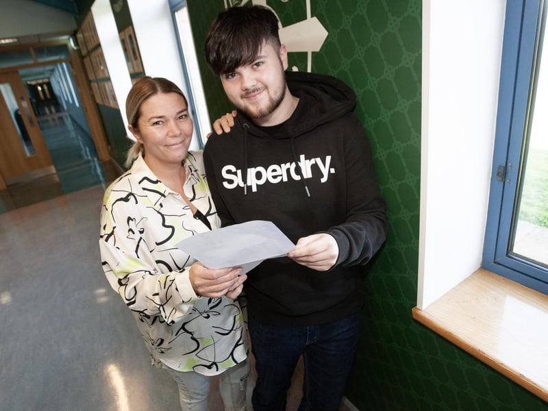 Eoghan McLaughlin shows his results to proud mum Lisa at St. Joseph's Boys' School on Thursday.