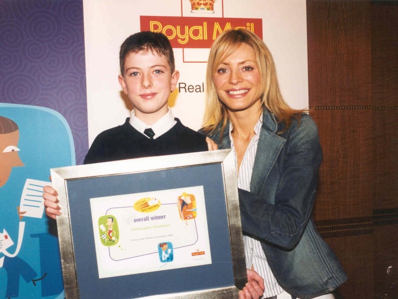 Royal Mail Young Letter Writer of the Year Christopher Chambers receives his award yesterday from children's TV presenter Tess Daly in London.