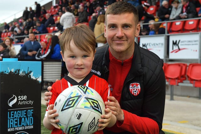 Derry City fan Evan Collins pictured with team captain Patrick McEleney before the game against UCD on Friday evening last. Photo: George Sweeney.  DER2320GS – 134