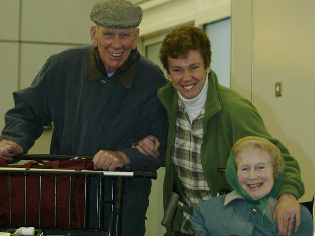 A delighted Eglinton resident Pam Hardiman has a big smile for parents Len and Kathy Newport when they arrived from Manchester at City of Derry Airport to spend Christmas with her and her family. (2312JB37)