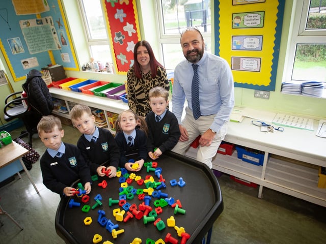 TWINS AT HOLLYBUSH PS. . . . .Mr. Feargal Friel, Acting Principal, Hollybush PS calls in to see some of the new P1s who've started school and was delighted to see twins - Cian and Cahir and Eimear and Ruairi. Included is Mrs. Debra White, teacher. (Photos: Jim McCafferty Photography)